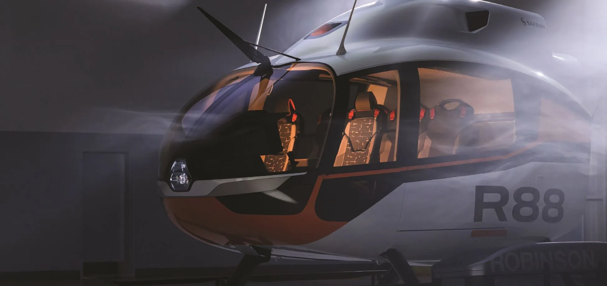 Side view of a Robinson R88 helicopter with orange and white paint scheme.