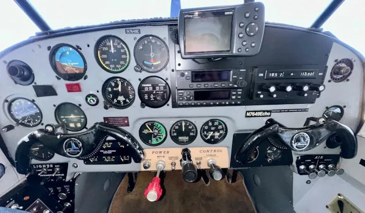 The instrument panel of the Bellanca 7GCBC Citabria N7649E, showing various gauges and a GPS unit.
