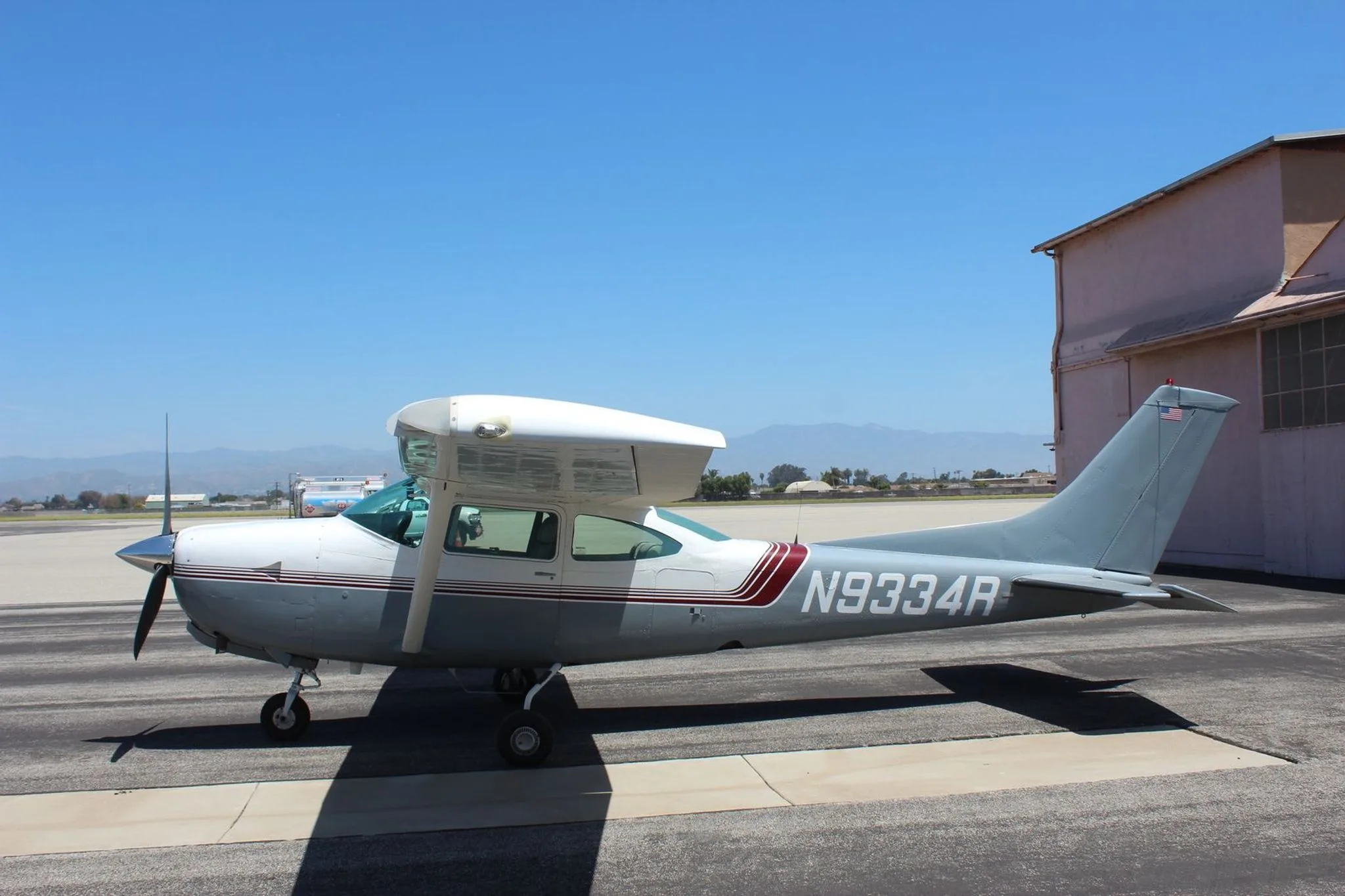 Side view of a Cessna TR182 on the tarmac.