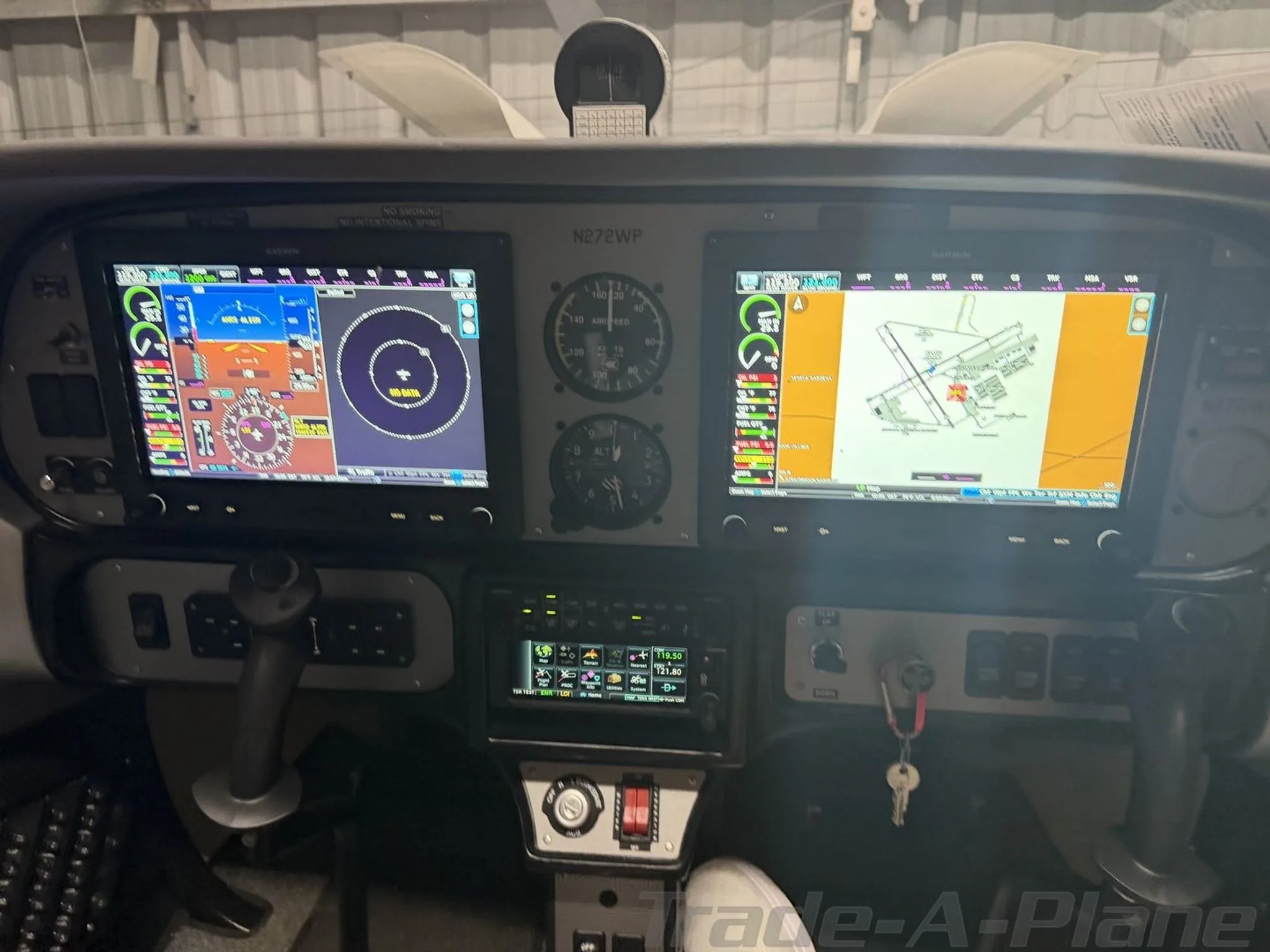 The cockpit of a Tecnam P2002 Sierra with Garmin G3X Touch displays showing flight data and a moving map.