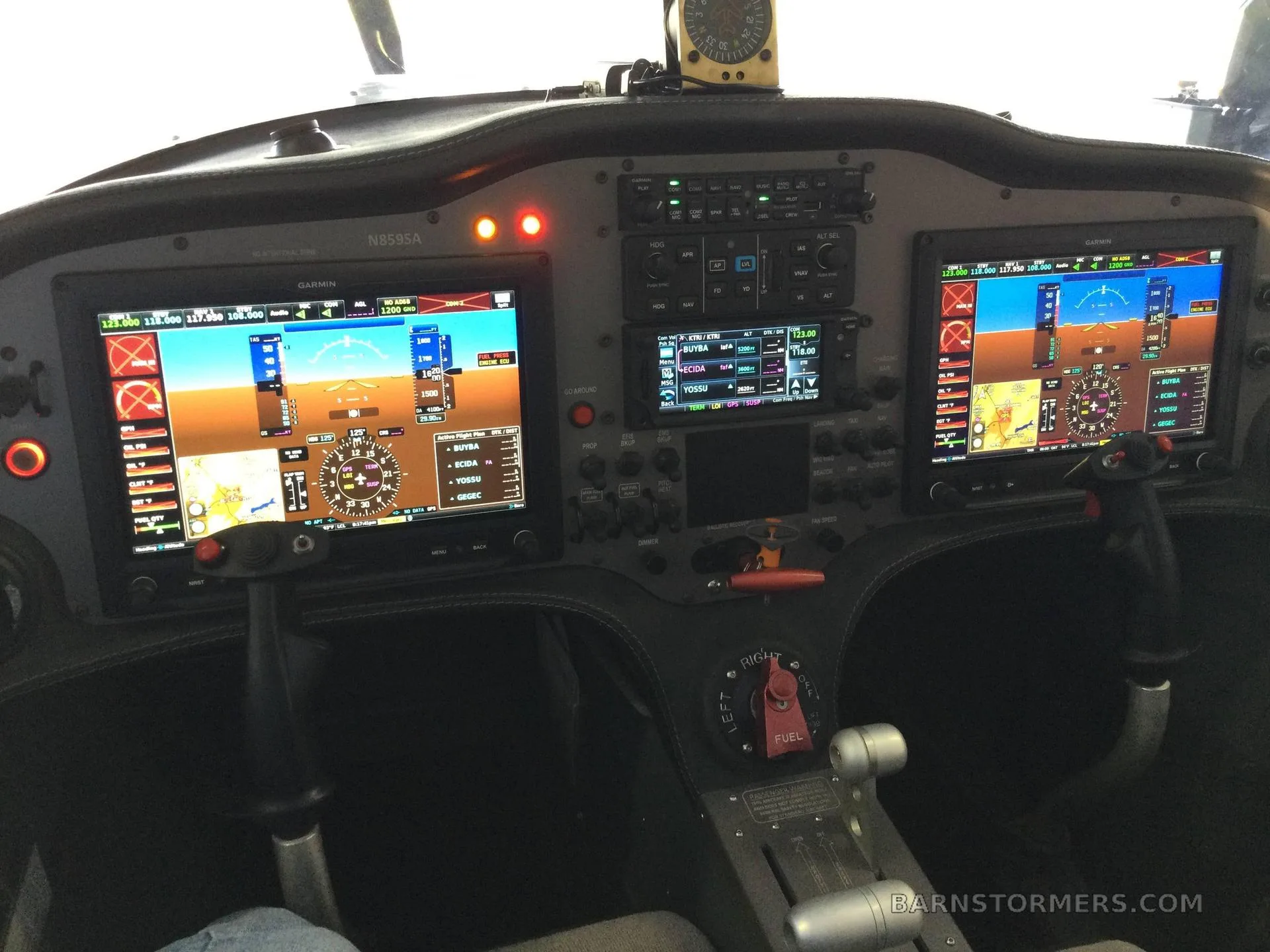 The cockpit of a Sling aircraft features a modern glass panel with two large Garmin displays and various controls.