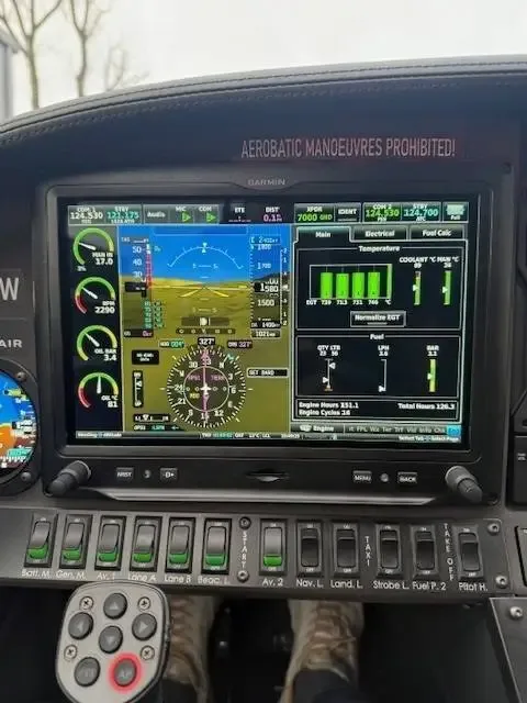 A close-up view of a modern glass cockpit display showing flight information and engine parameters.