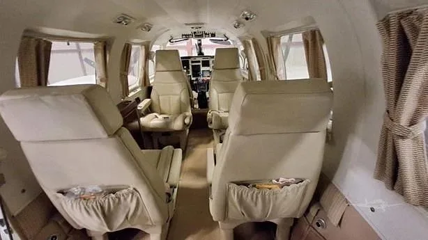 A view of the cabin with seats arranged for passenger comfort.