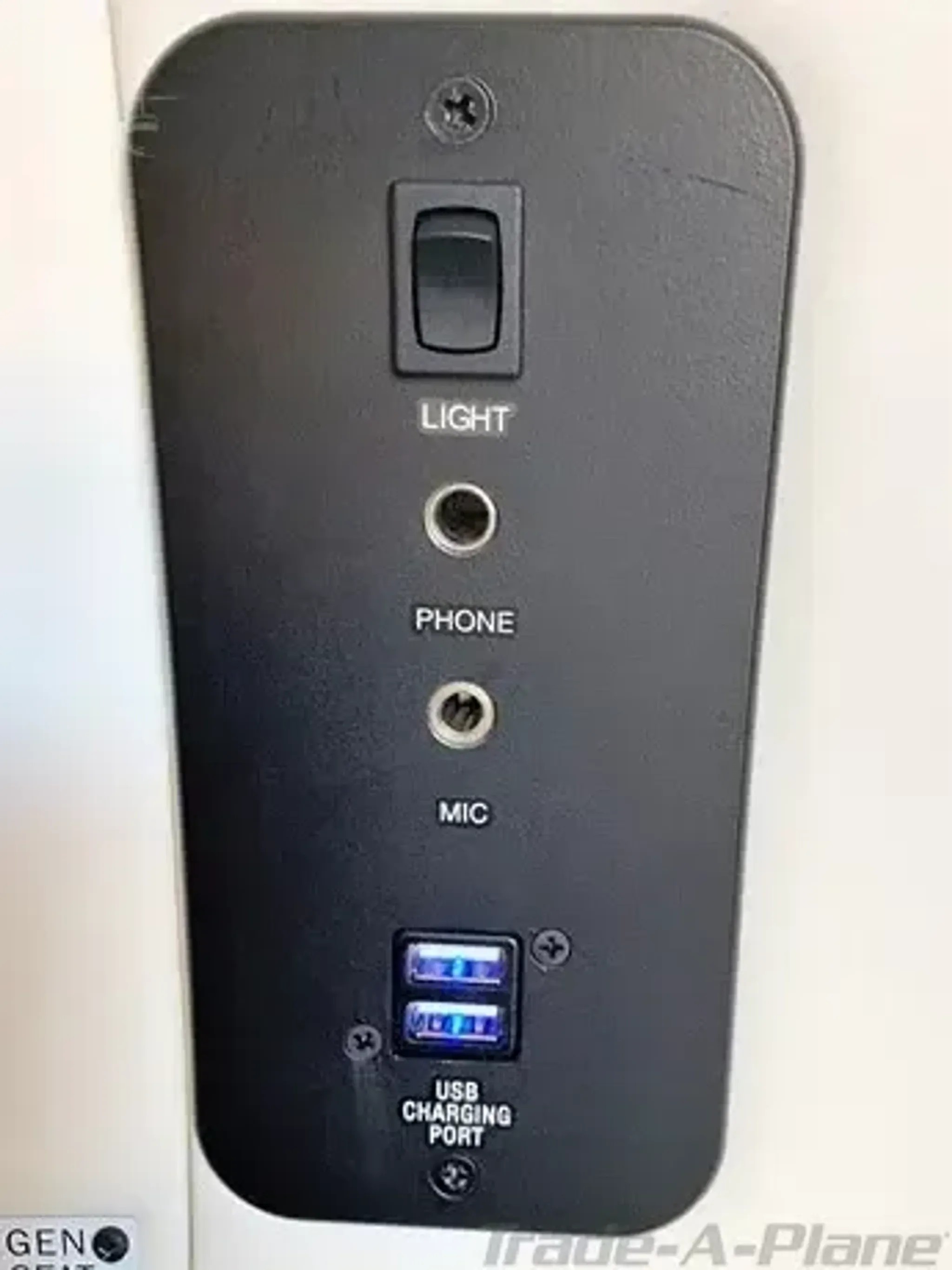 Control panel with various switches and ports.