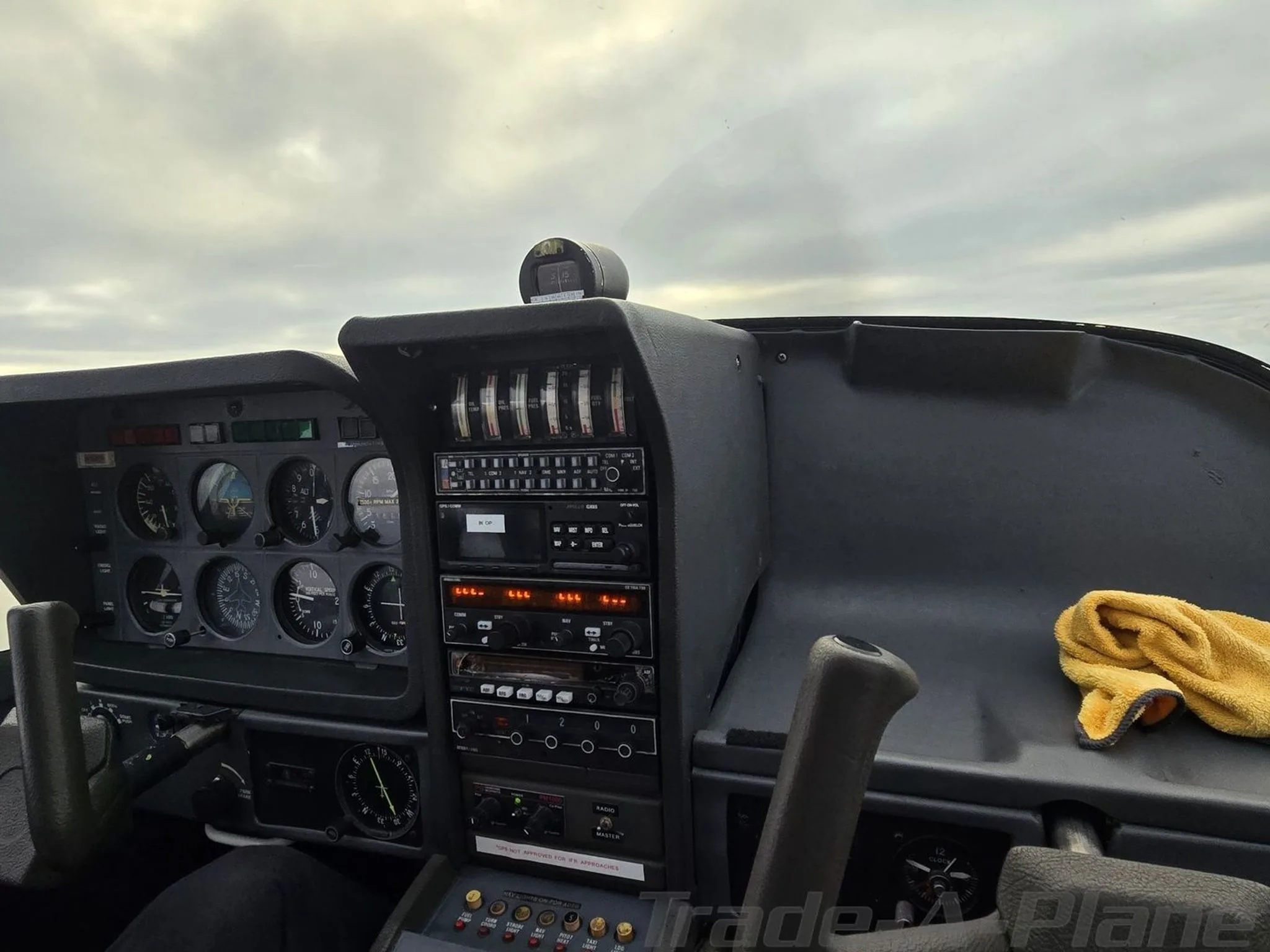 The cockpit instrument panel of the N130ER aircraft, featuring analog gauges and avionics.