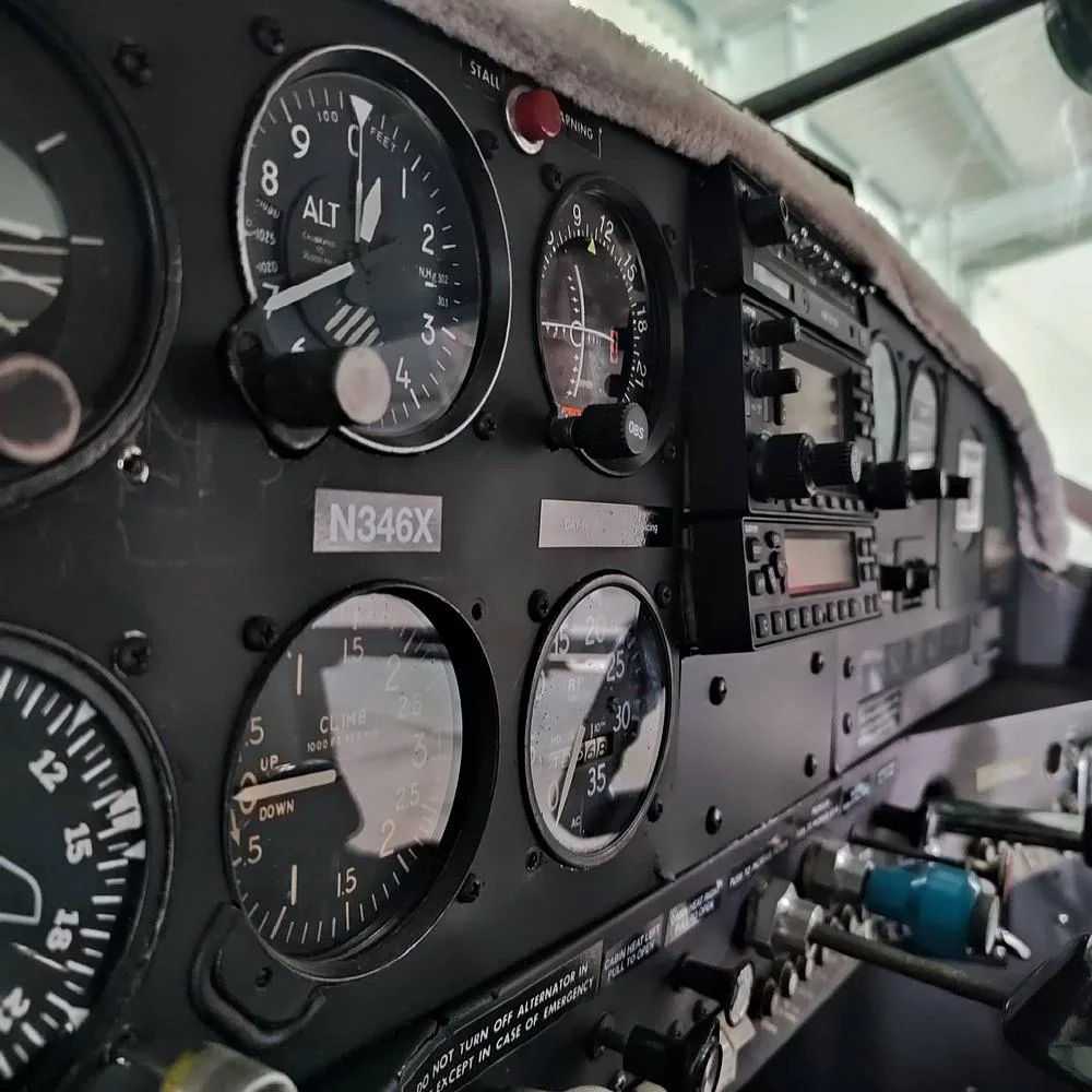A side view of the N346X cockpit instrument panel, showing various gauges and controls.