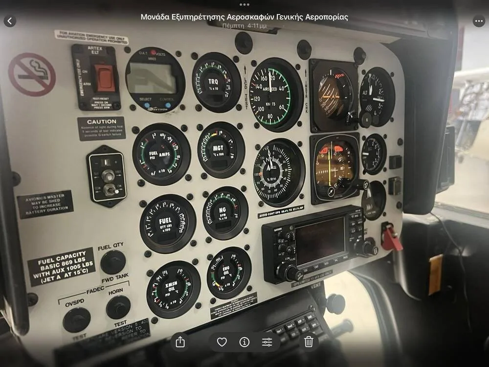 A detailed view of the analog and digital gauges on a helicopter's instrument panel.
