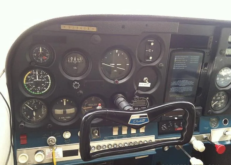 Close-up view of the instrument panel and yoke of the Cessna Skylane N2342X.