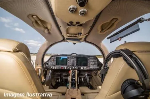 A view from inside the cockpit of a Diamond DA62, showing the instrument panel and front seats.
