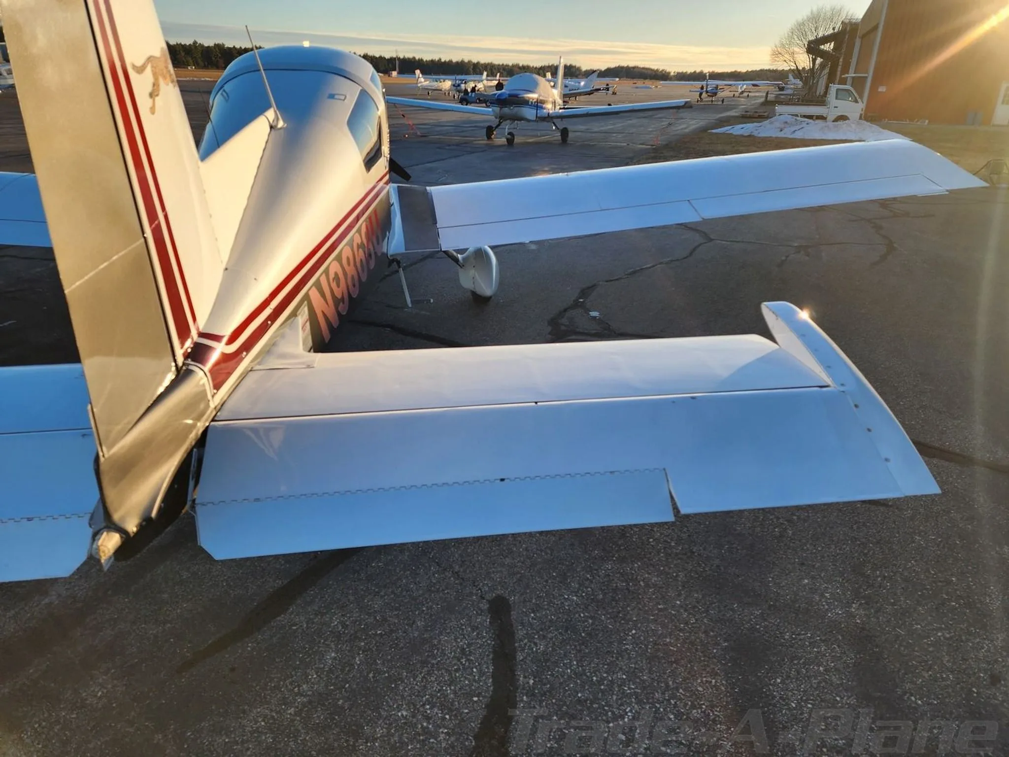 Another rear view of the aircraft with other planes in the background.