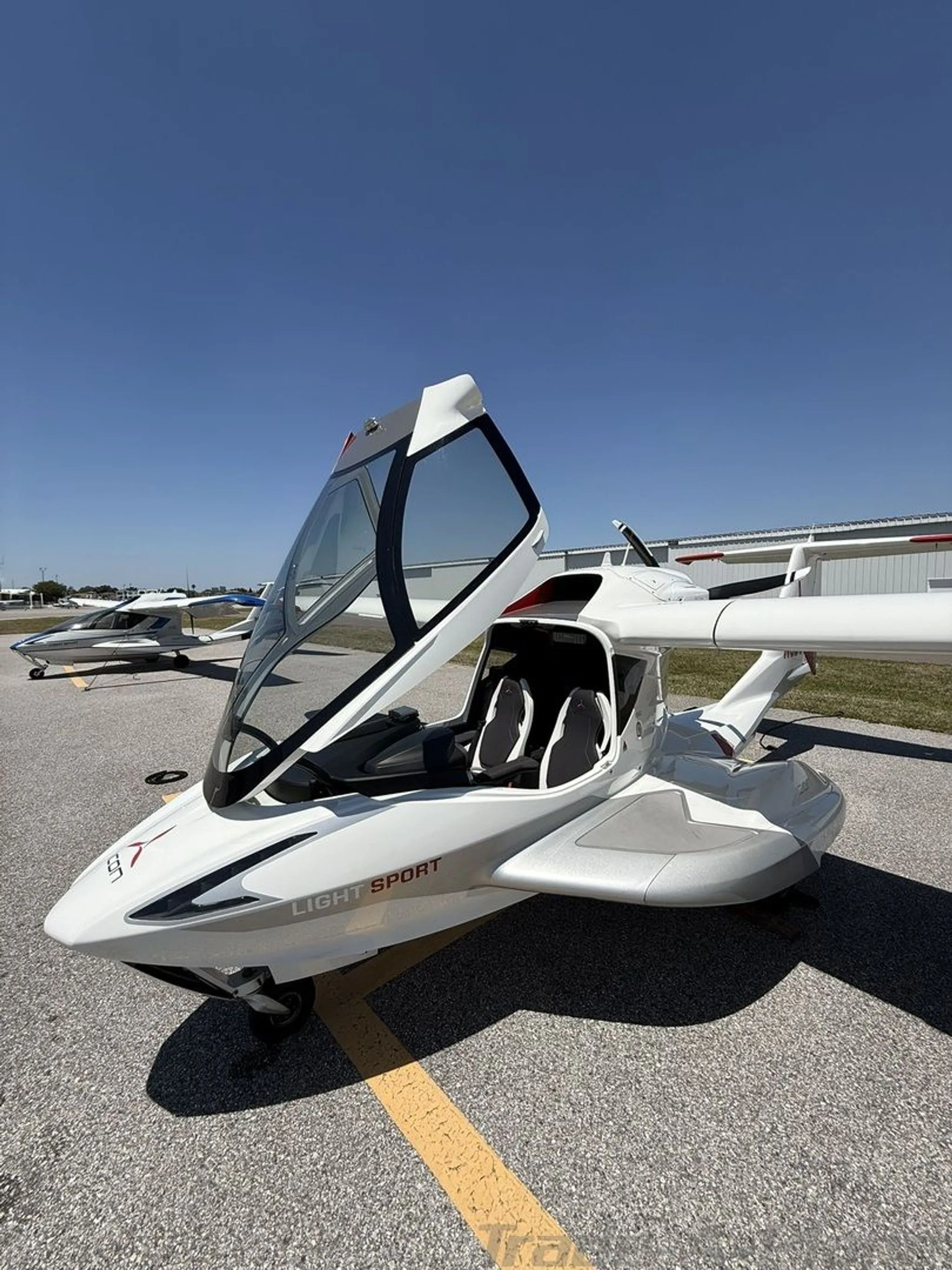 A side view of the ICON A5 on the ground.