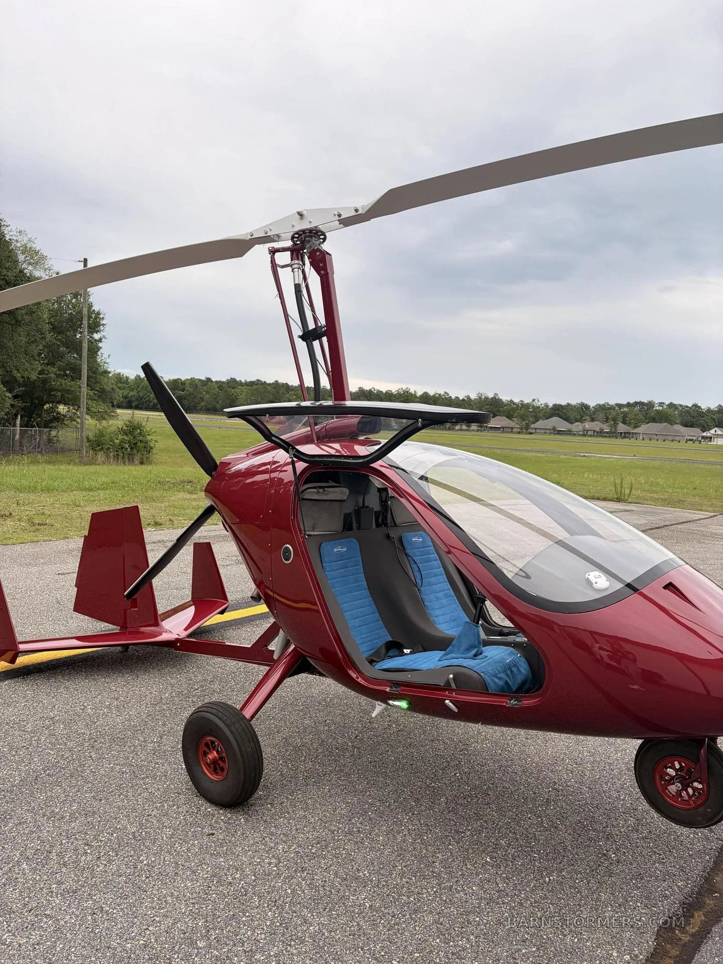 Another angle of the red MAGNI M24 GYRO with the door open.