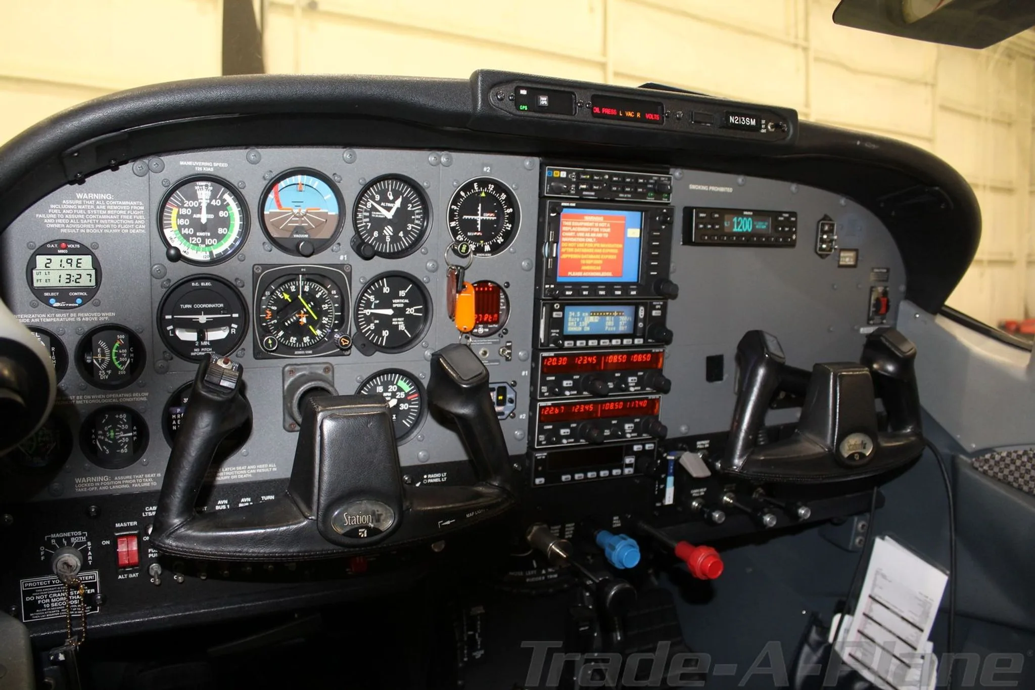 Cockpit view displaying the instrument panel of the Cessna 206H.