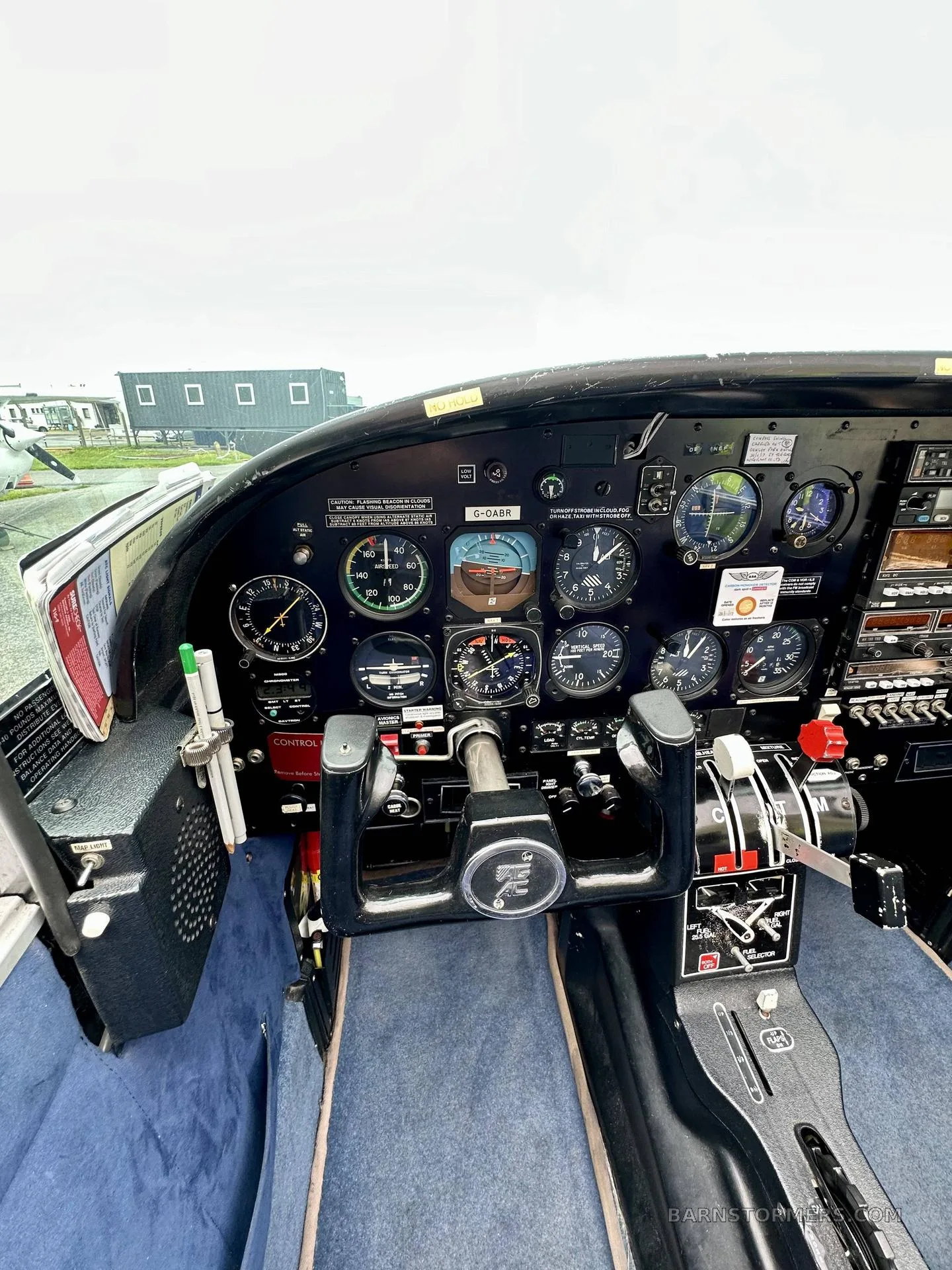 A close-up view of the aircraft's instrument panel with various gauges and controls.