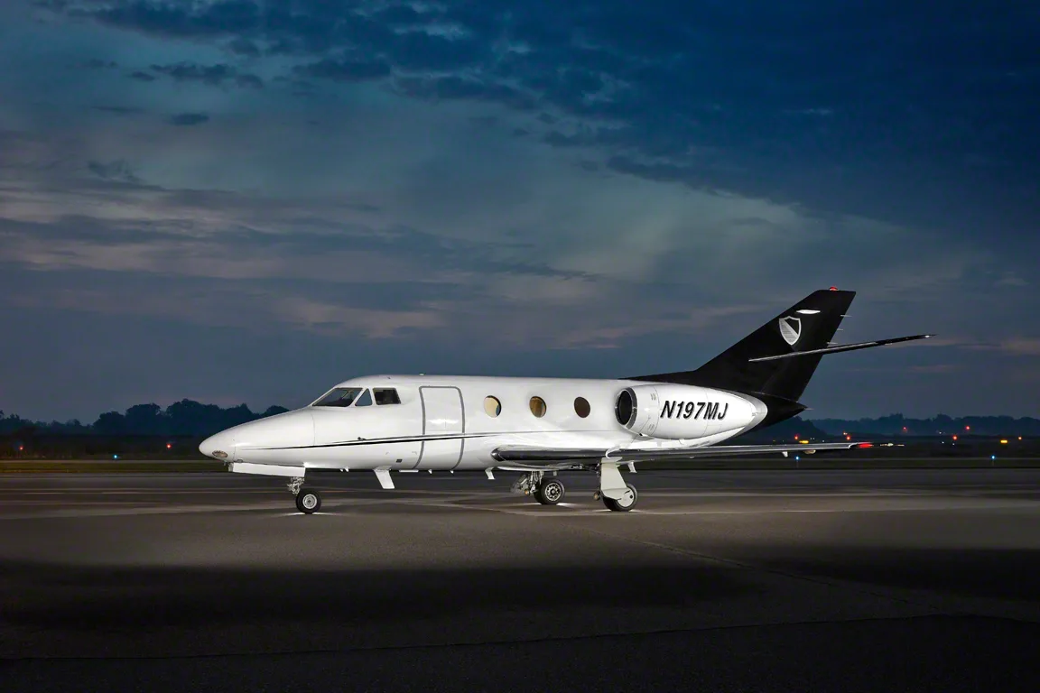 N197MJ aircraft on the tarmac at dusk.
