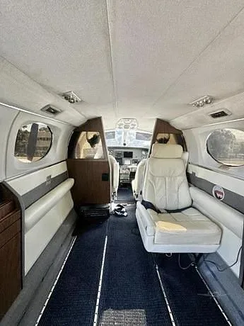 View of the cockpit area with a seat and instrument panel.
