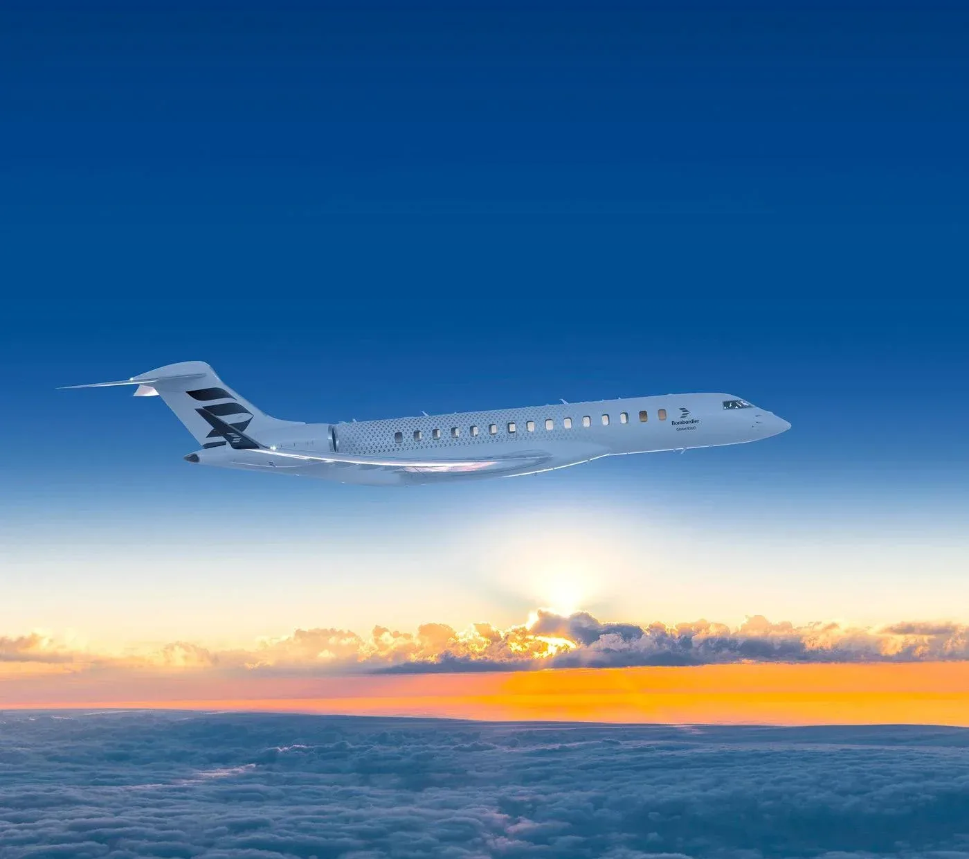 A white Bombardier Global business jet with black tail markings flies above clouds at sunset.