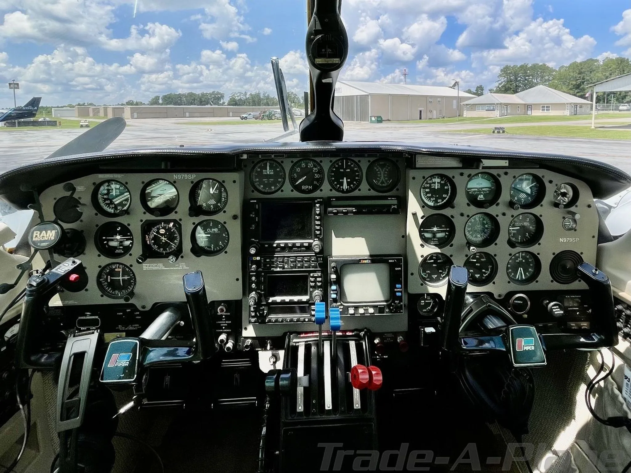 The detailed instrument panel and controls of the aircraft's cockpit, with the registration N979SP visible.