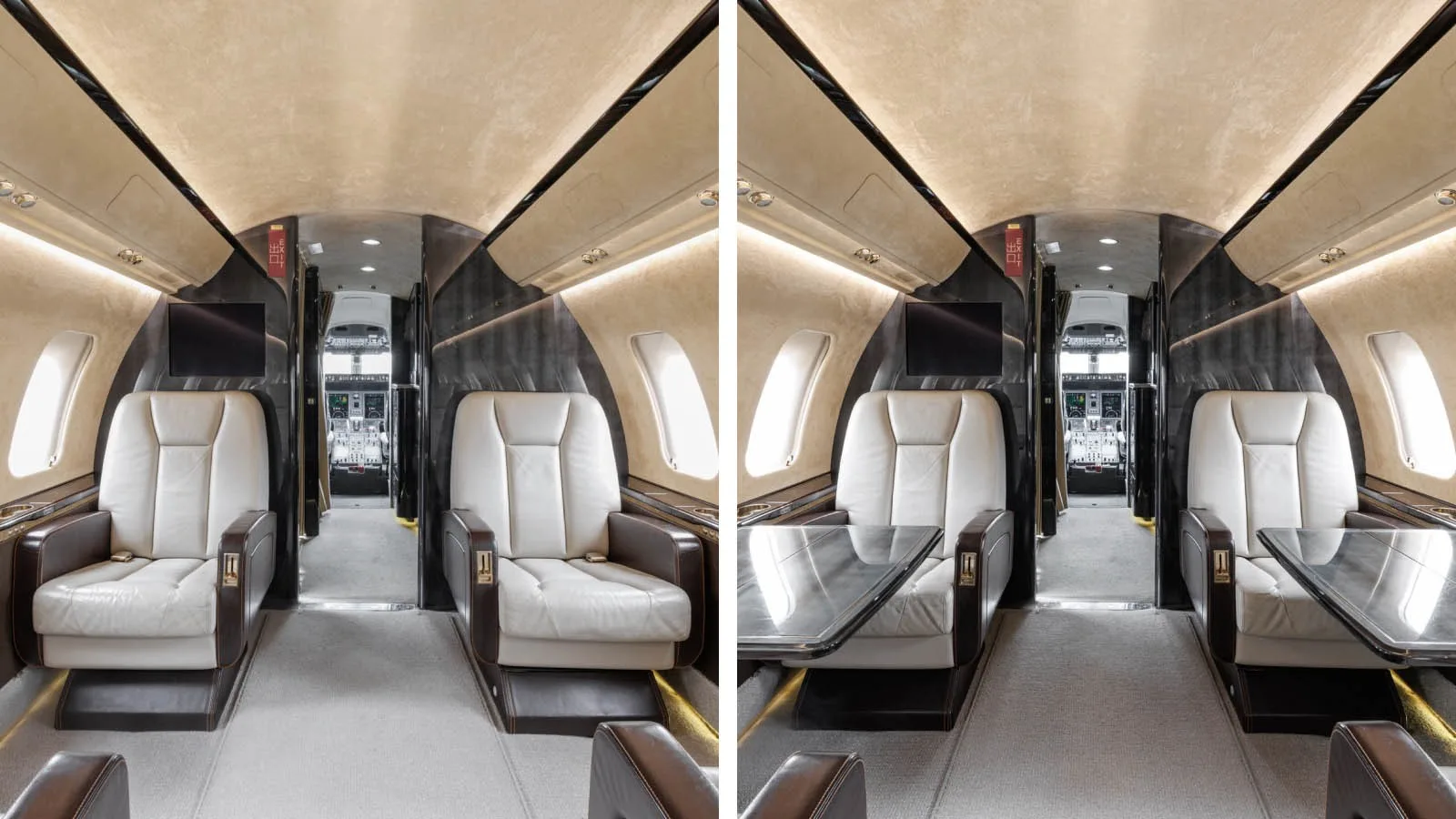 The aircraft cabin featuring two sets of opposing cream leather seats with dark brown accents and a deployable table.