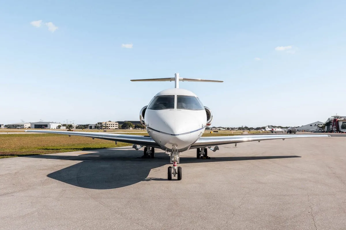 The front view of a white Hawker 800XP business jet, likely N339RA, parked on the tarmac.