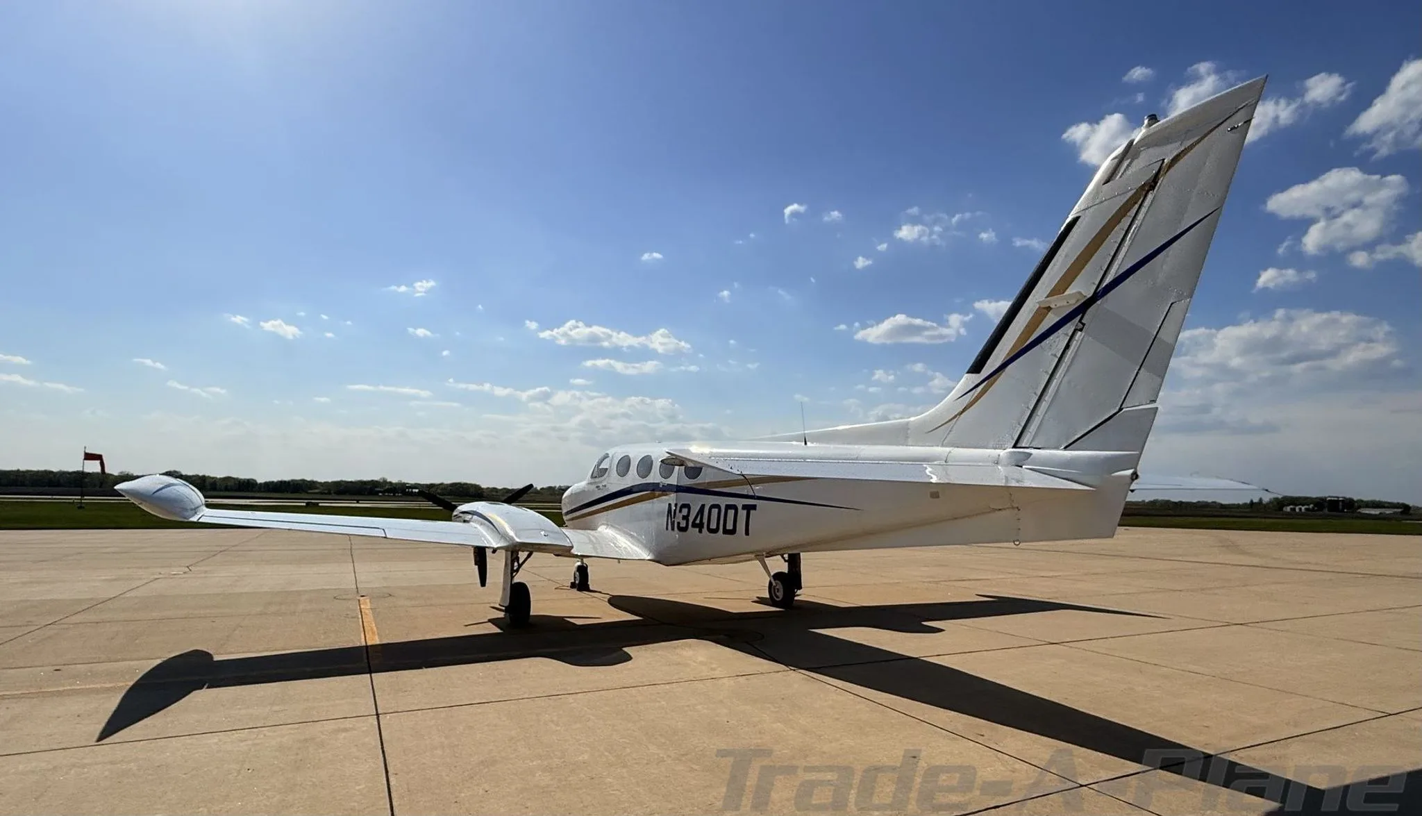 Side profile of the Cessna 340A with a clear sky.