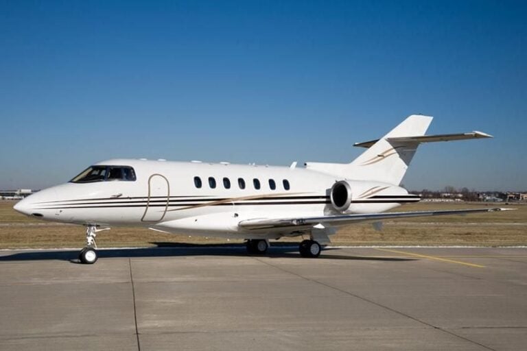 Eclipse 500 in flight with blue sky background.