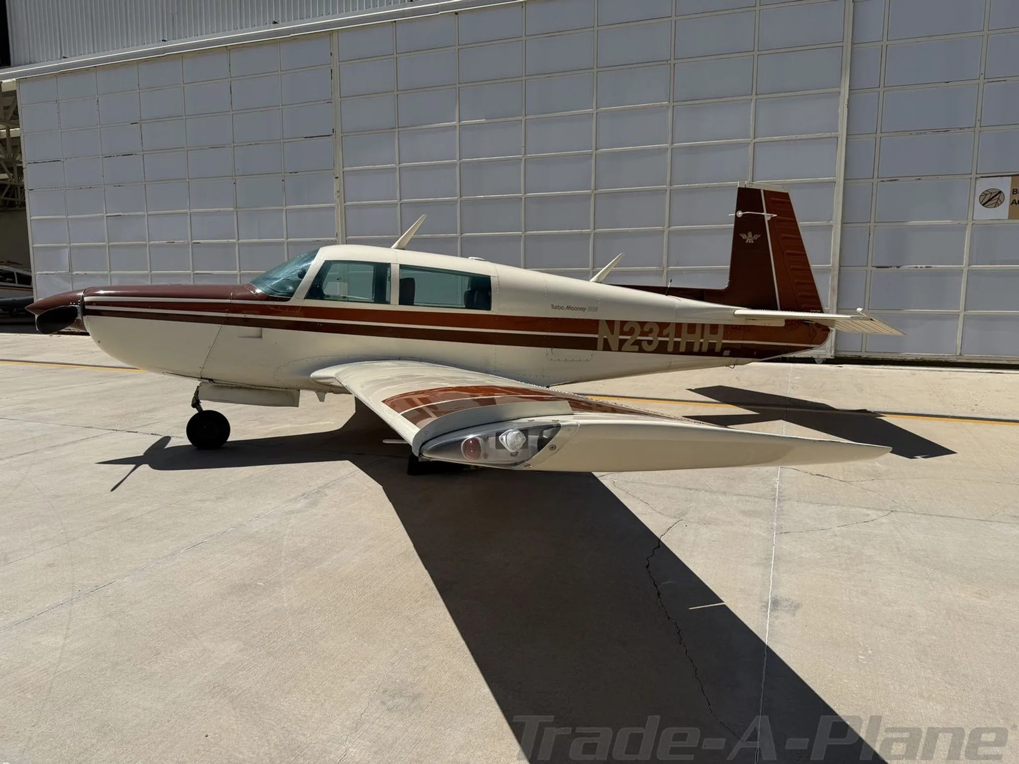 Close-up view of the Mooney M20K 231's side.