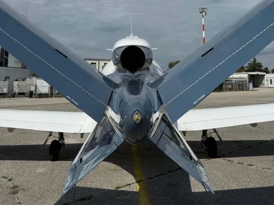A rear view of the Cirrus Vision Jet showing its V-tail and single jet engine exhaust.