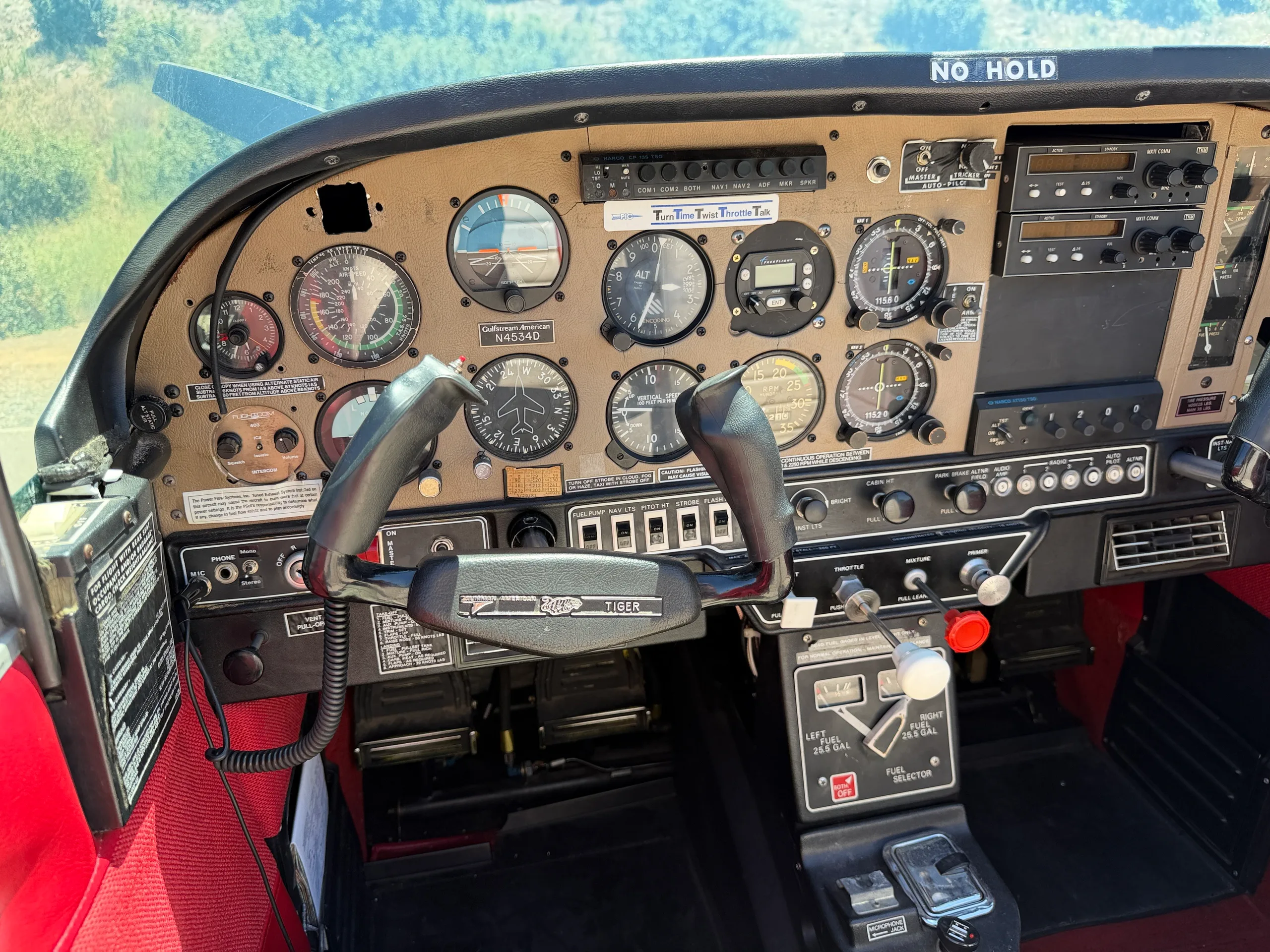 A detailed view of the pilot's side of the cockpit, showing the yoke, instruments, and controls.