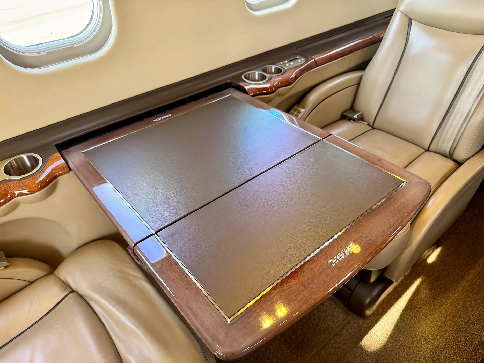 View of the aircraft interior with a fold-out table.