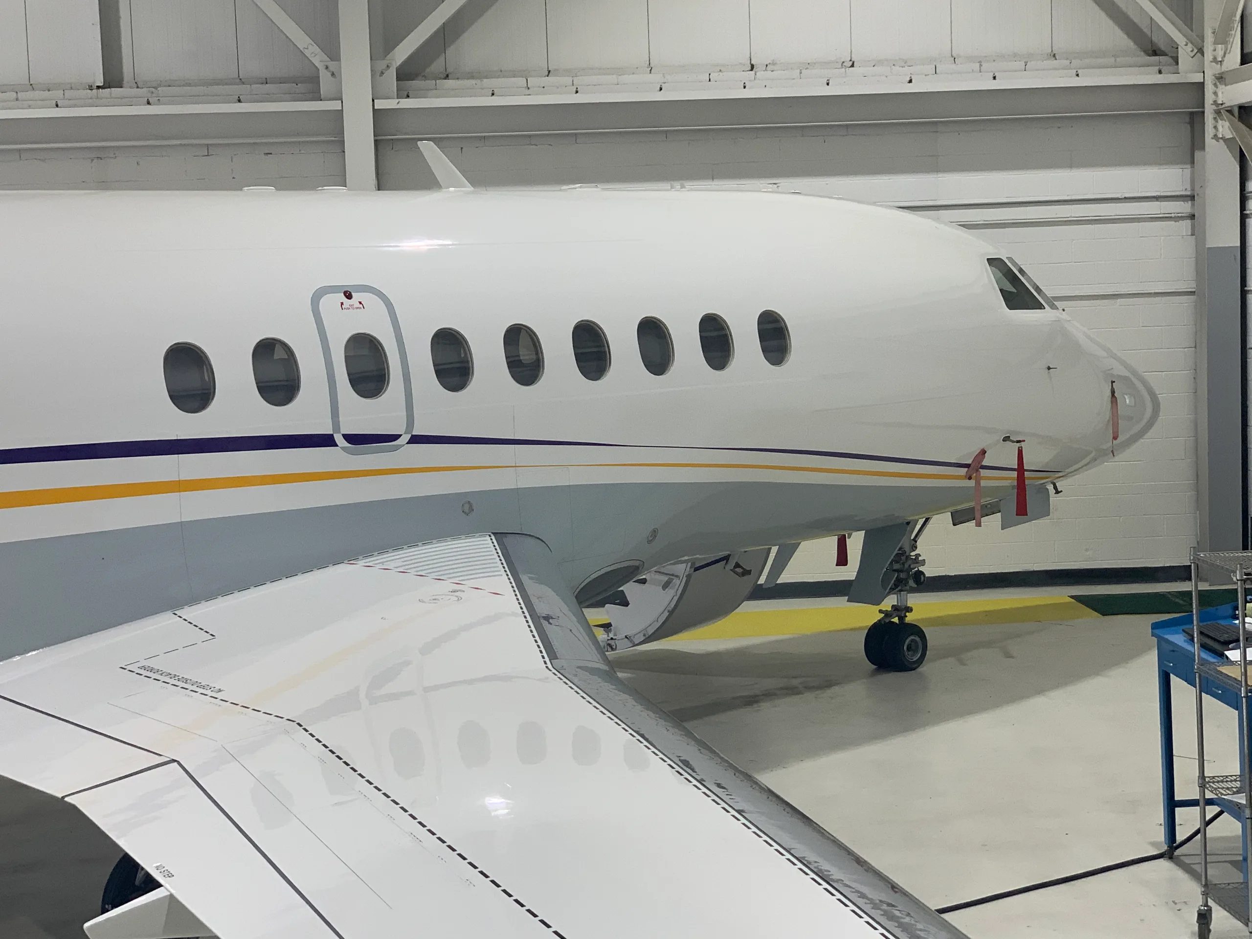 View of the aircraft's cockpit featuring the instrument panel and seats.