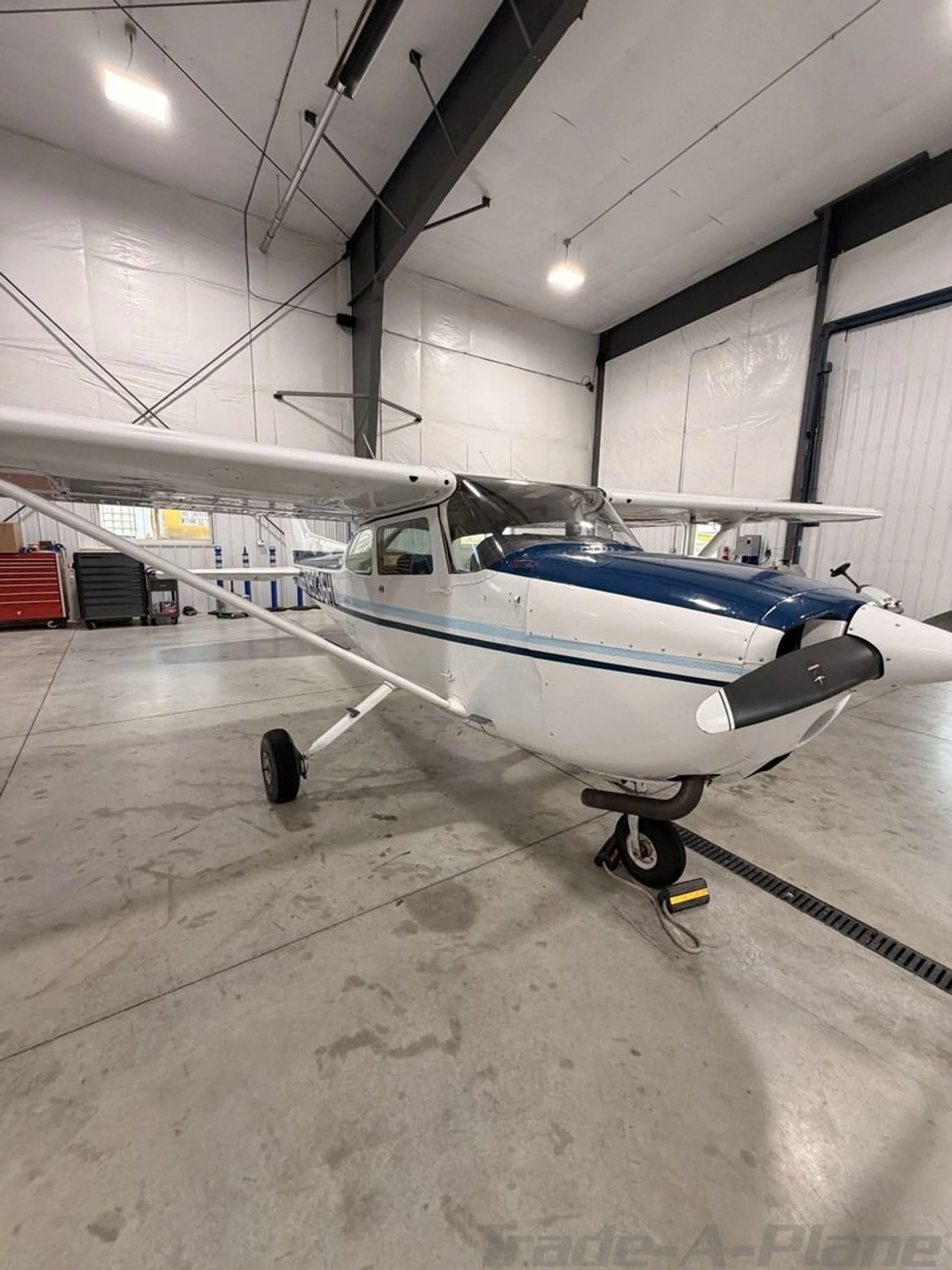 Front view of the Cessna 172M Skyhawk in a hangar.