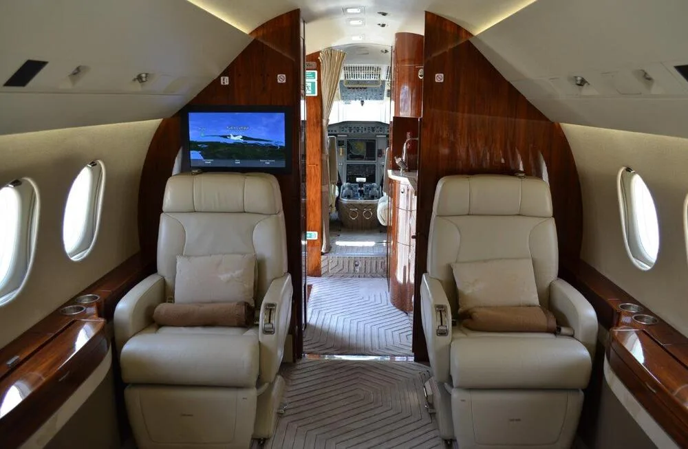 Interior view focusing on seating and entertainment options.