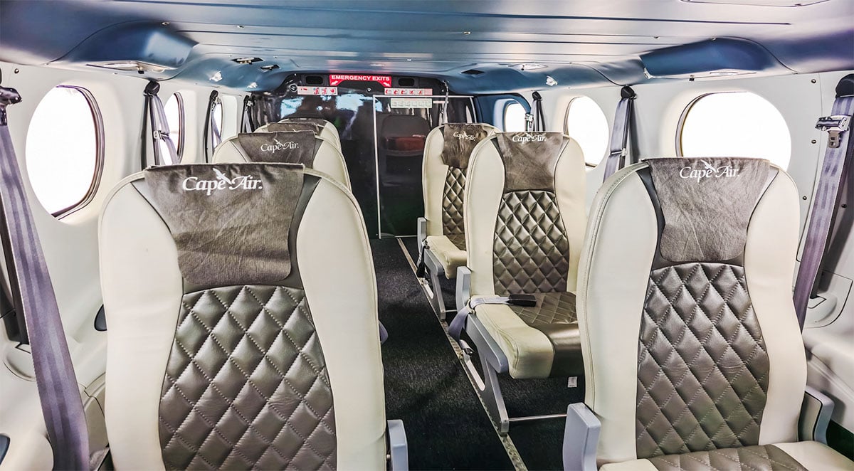 The interior of a Tecnam P2012 Traveller with Cape Air branded seats.
