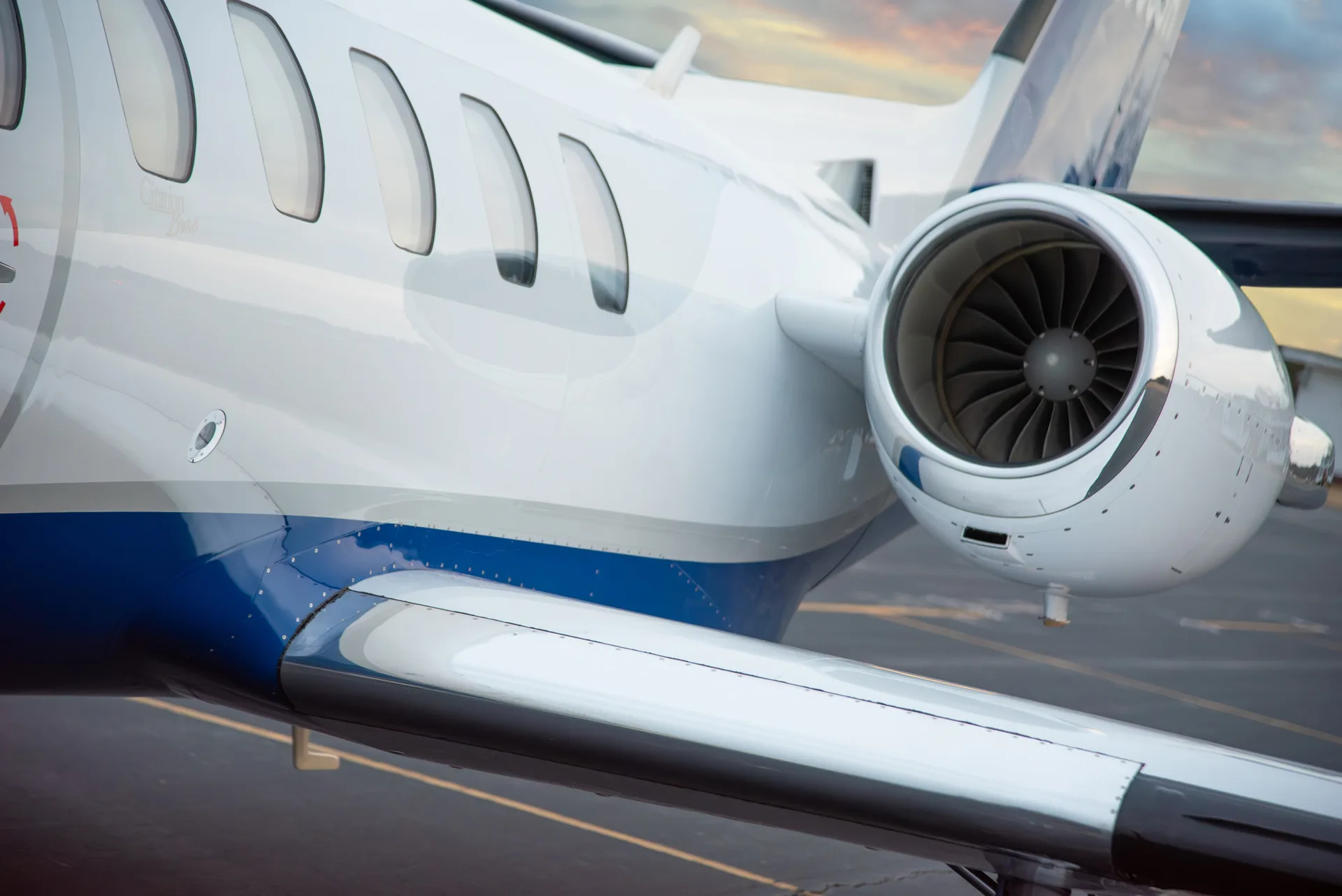 A close-up of the engine and fuselage of a Citation Bravo aircraft.