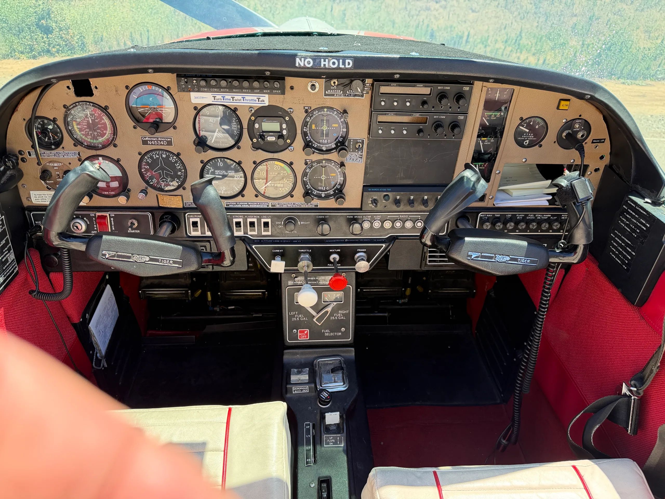 A close-up view of the aircraft's instrument panel with various gauges and controls.