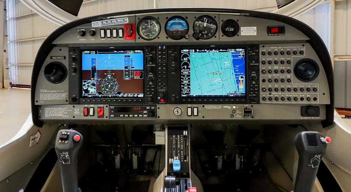 The cockpit of a Diamond DA40 Star aircraft, showing the Garmin G1000 glass panel and traditional gauges.
