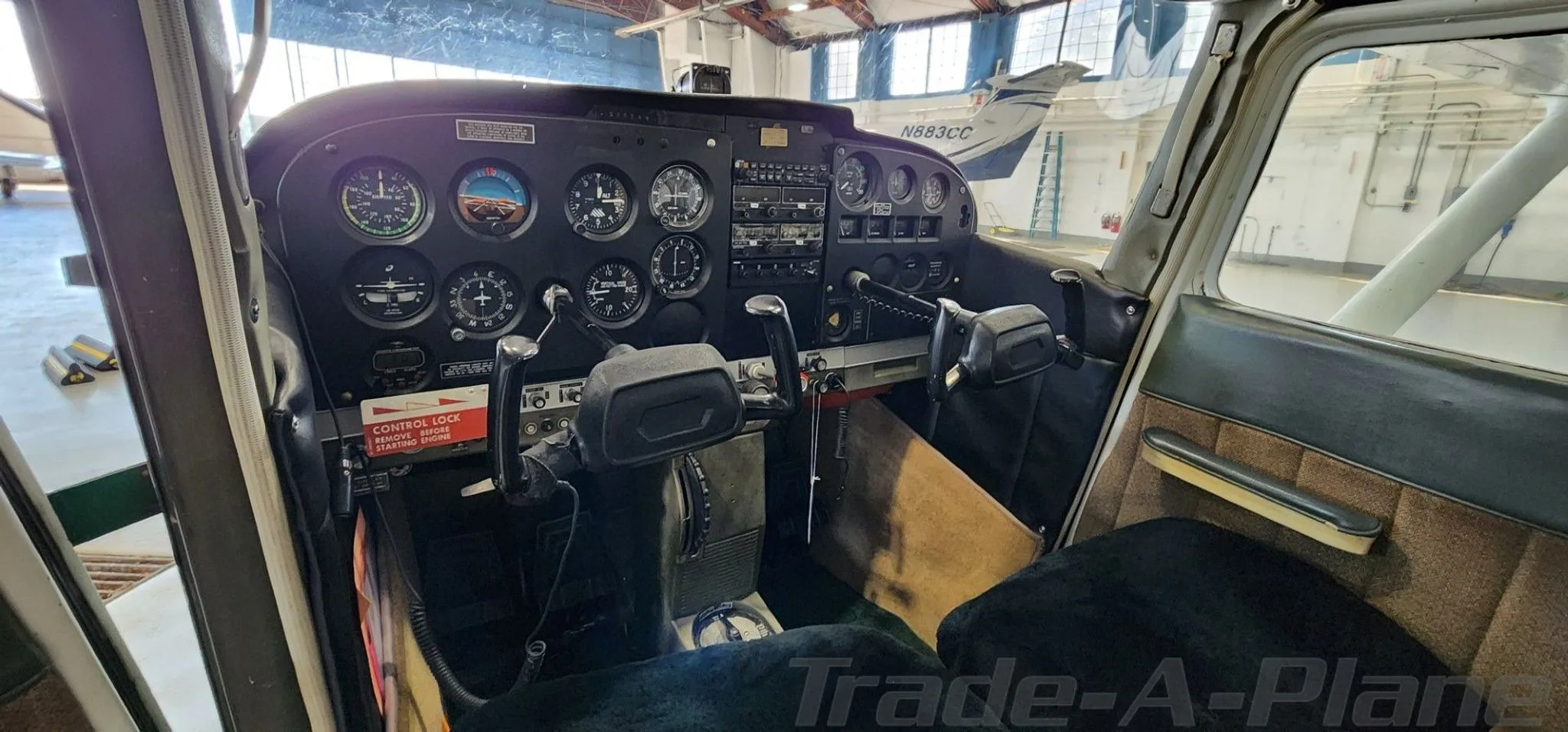 The cockpit of the Cessna 172 showing the instrument panel.