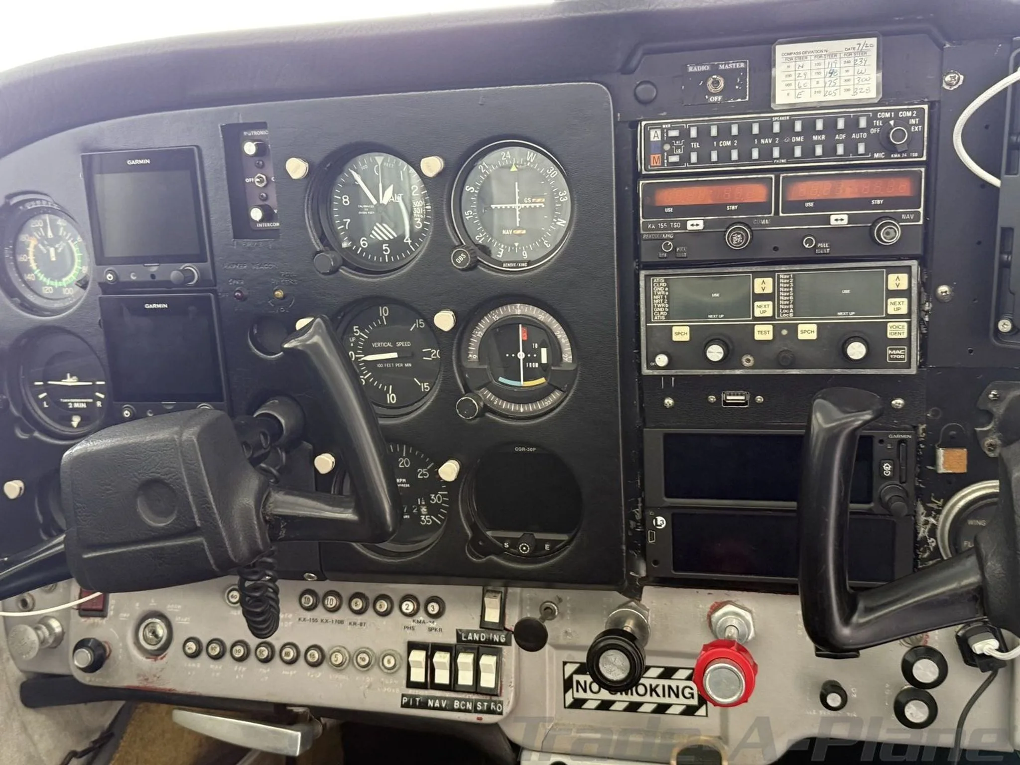 A close-up view of the Cessna Skyhawk's instrument panel with various gauges and avionics.