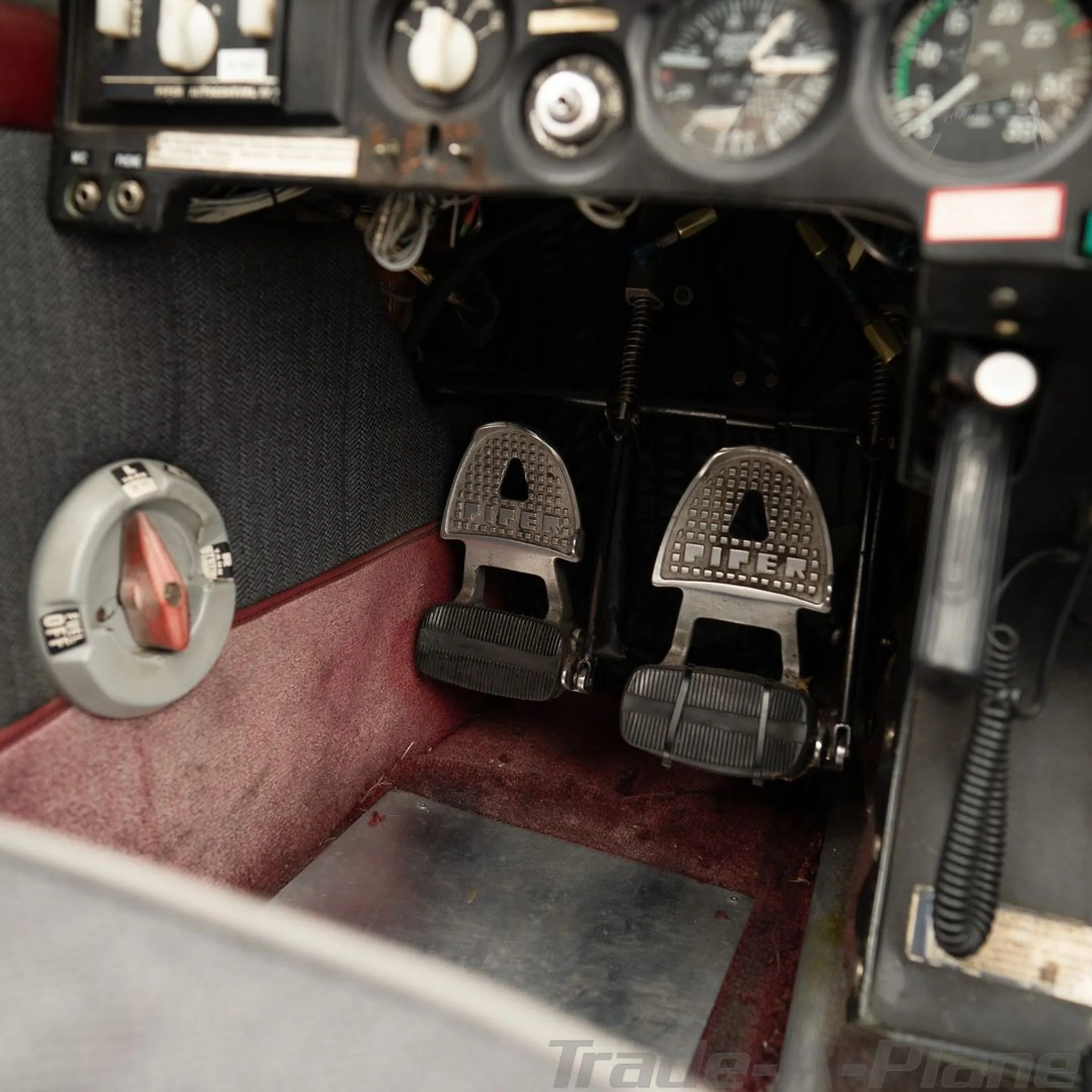 Close-up view of the aircraft's rudder pedals and floor.
