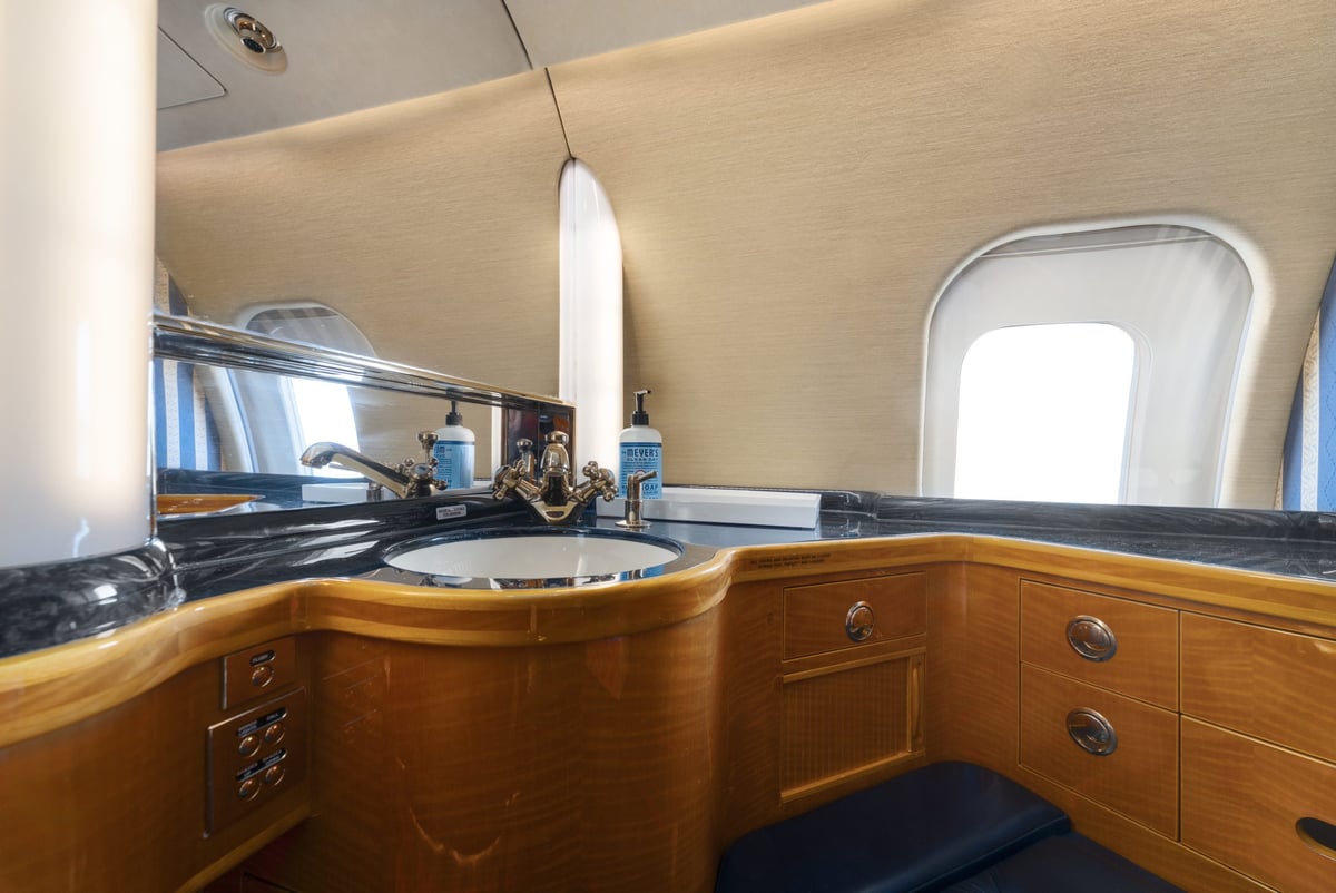 The lavatory of a Bombardier Global Express with a sink and mirror.