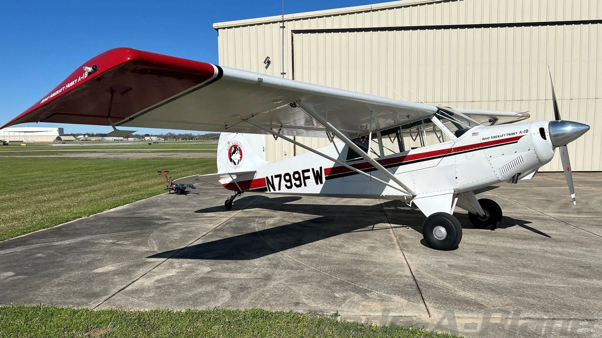 A side view of the 1999 Aviat Husky A-1B on the ground.