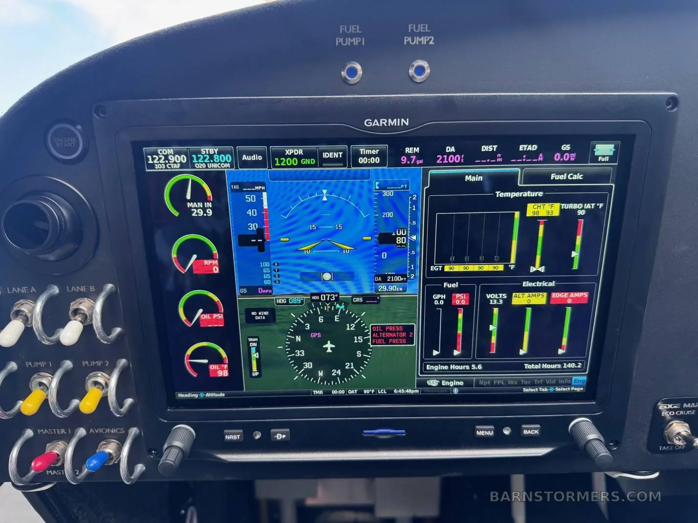 A close-up view of a Garmin glass cockpit display showing flight instruments, engine parameters, and fuel data.