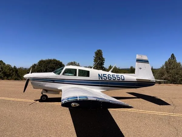 Another angle of the Mooney M20C on the road.
