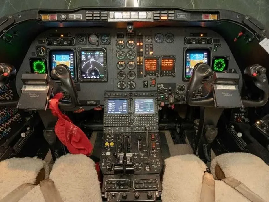 Detailed view of the aircraft cockpit with various instruments and controls.