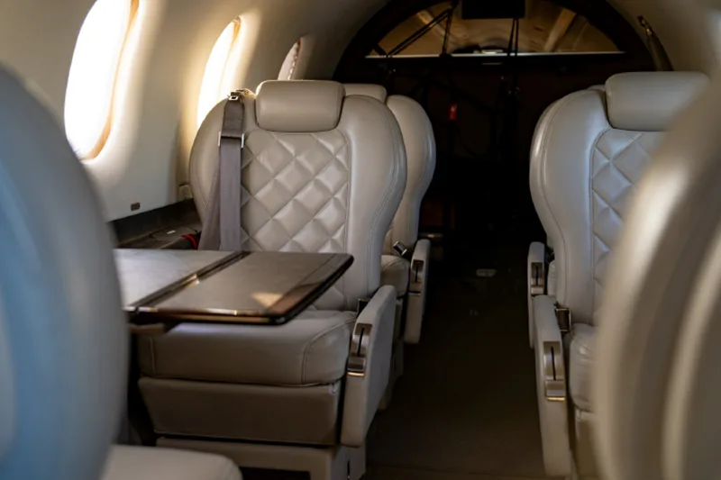 View of the interior cabin seats and fold-down table.