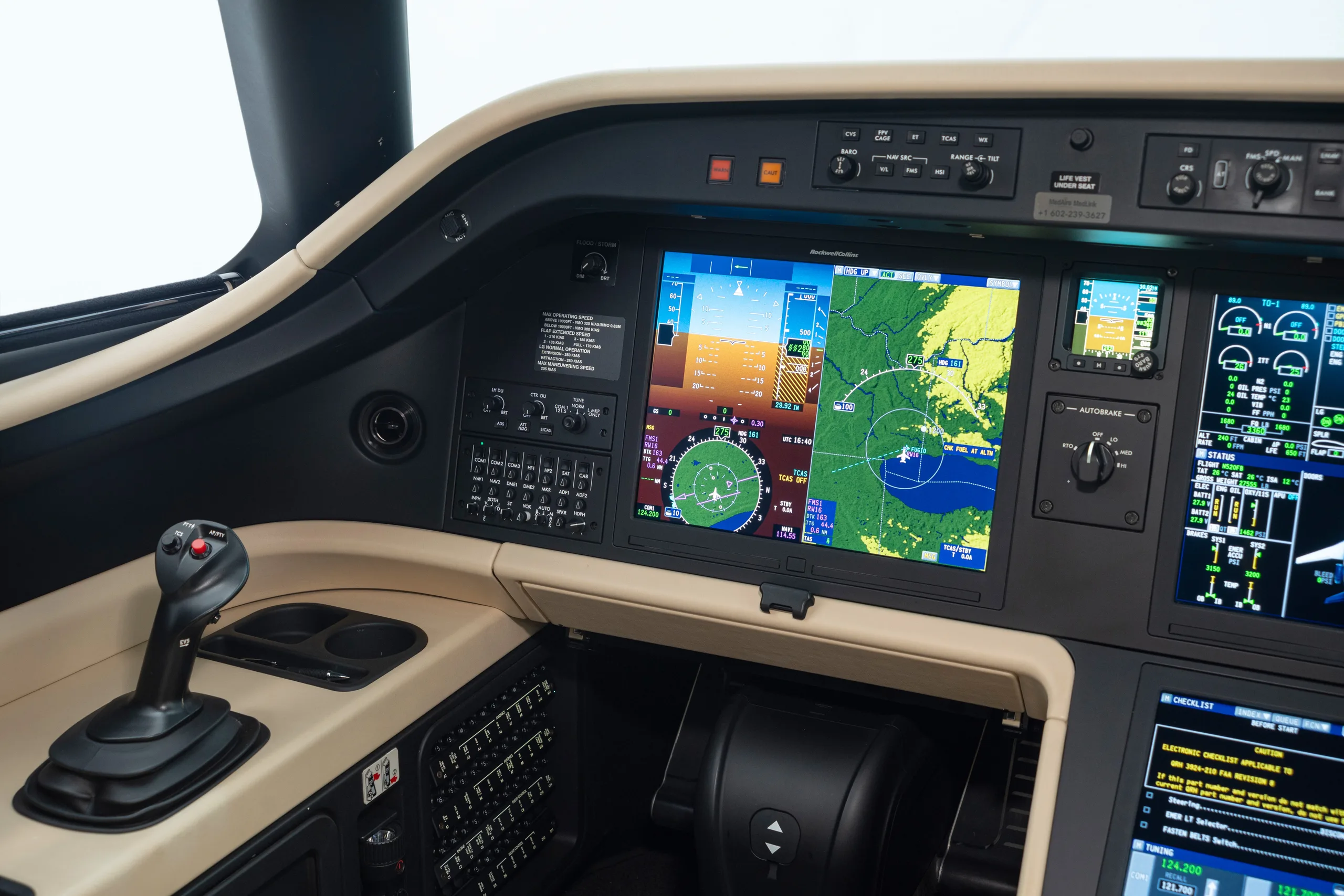 A view of the pilot's side of a modern aircraft cockpit, showing the primary flight display and controls.