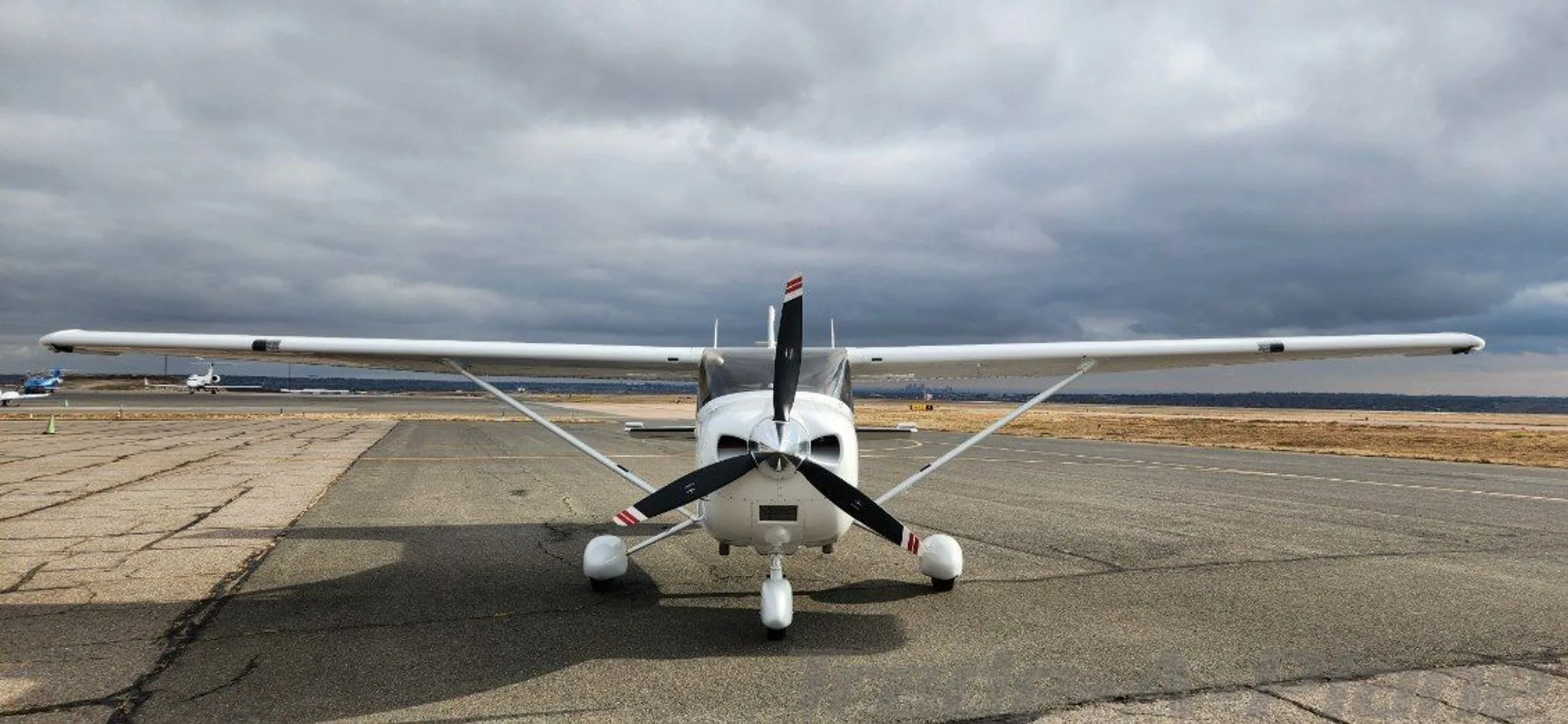 Front view of the Cessna 182T Skylane on the runway.