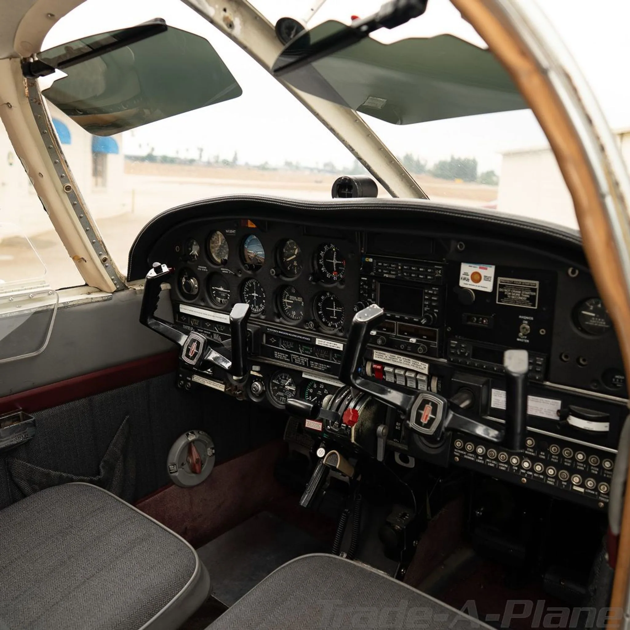 View of the aircraft's instrument panel and controls from the pilot's seat.