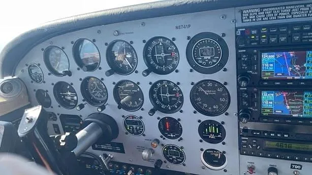 A close-up view of the detailed instrument panel in the cockpit of N8741P.